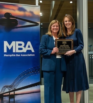 Memphis Bar Association President Lauran Stimac presents the Jerome Turner Award to Shea Wellford