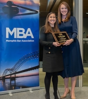 Memphis Bar Association President Lauran Stimac presents the Sam Myar Award to Natalie Bursi