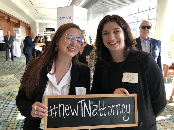 New lawyers celebrate after taking the oath