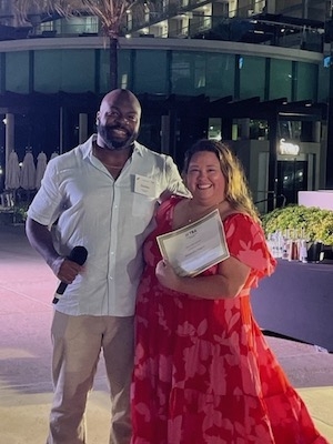 TBA YLD President Quinton Thompson presents a Star of the Quarter award to Nashville lawyer Alix Rogers for her work on recent pro bono clinics and law school visits