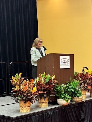 TBA Executive Director Sheree Wright introduces TBA President Ed Lanquist