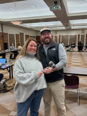 Alix Rogers presents the YLD Disco Gavel to YLD President Sean Aiello