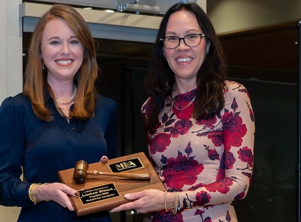 Lauran Stimac passes gavel to Marlinee Iverson