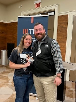 Savannah Oliver receives the TBA YLD Star of the Quarter Award from President Sean Aiello