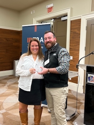 Nashville lawyer Alix Rogers receives the TBA YLD Star of the Quarter Award from President Sean Aiello